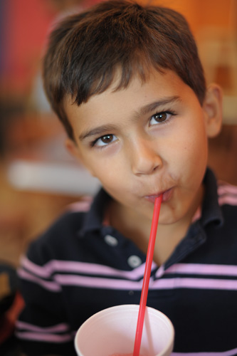 Ryan slurps his lemonade